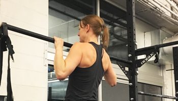 Sidney performing a pull up exercise